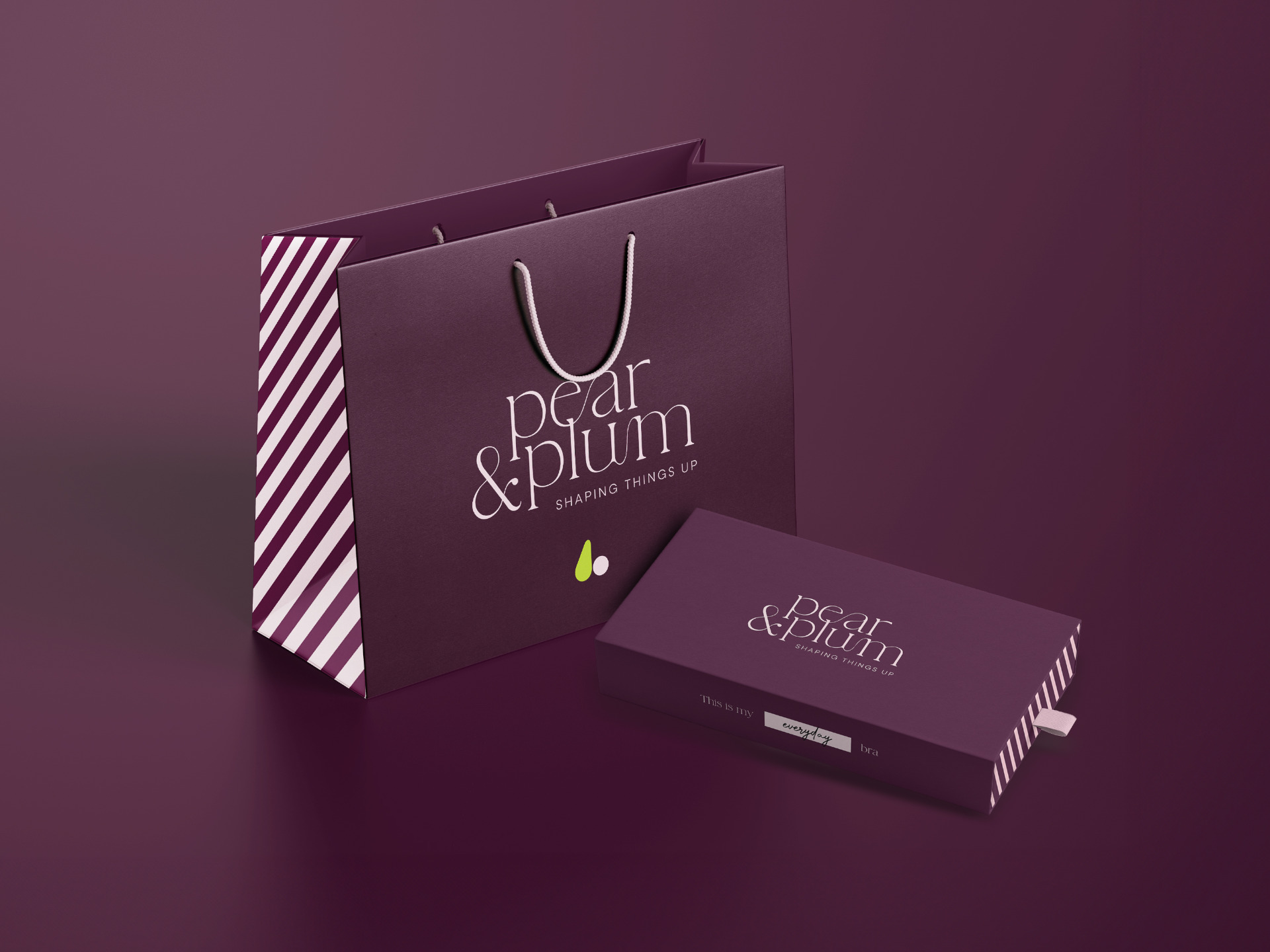 A purple bag and box with Pear & Plum brand logo