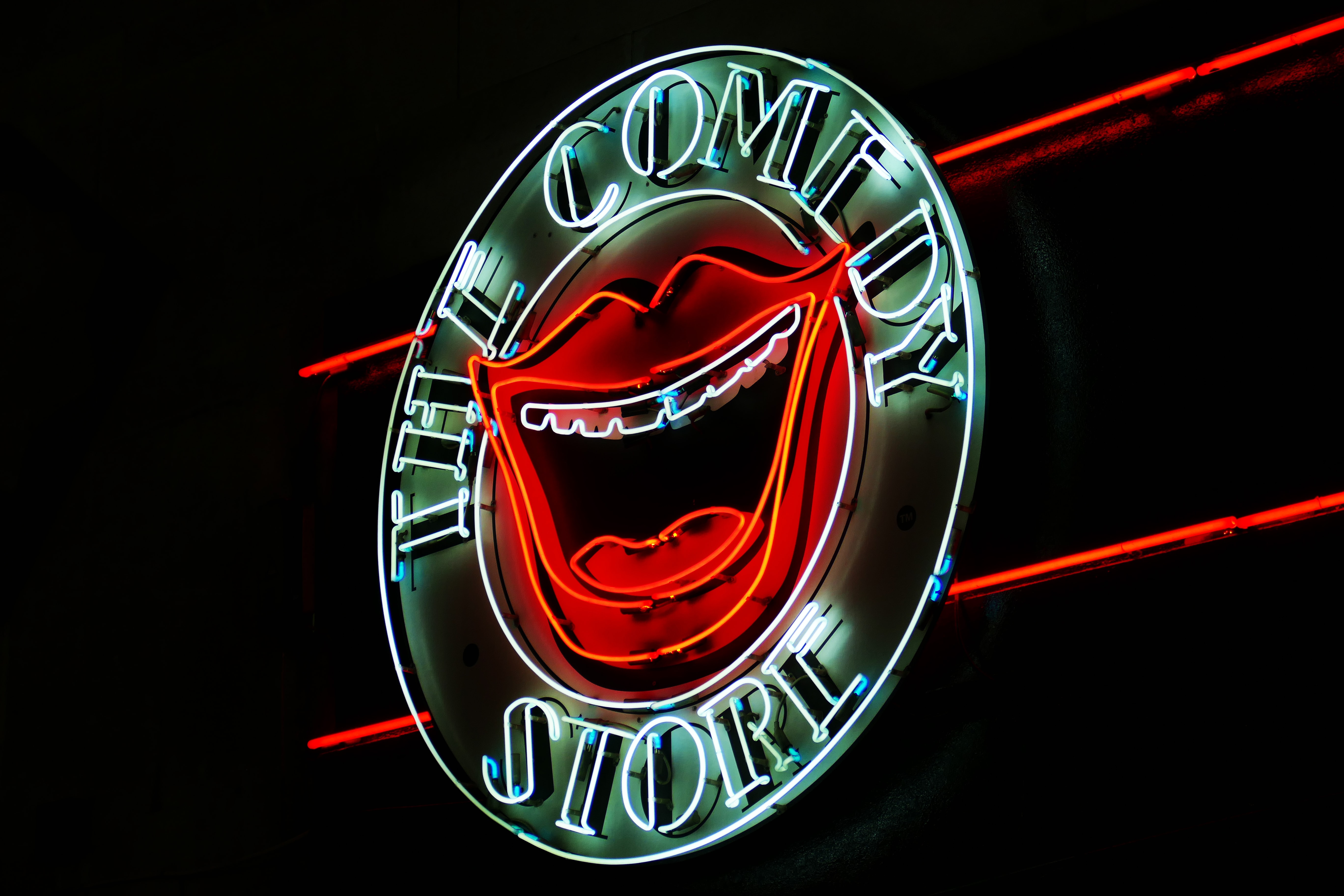 A light up wall decoration with the words The Comedy Store illuminated.