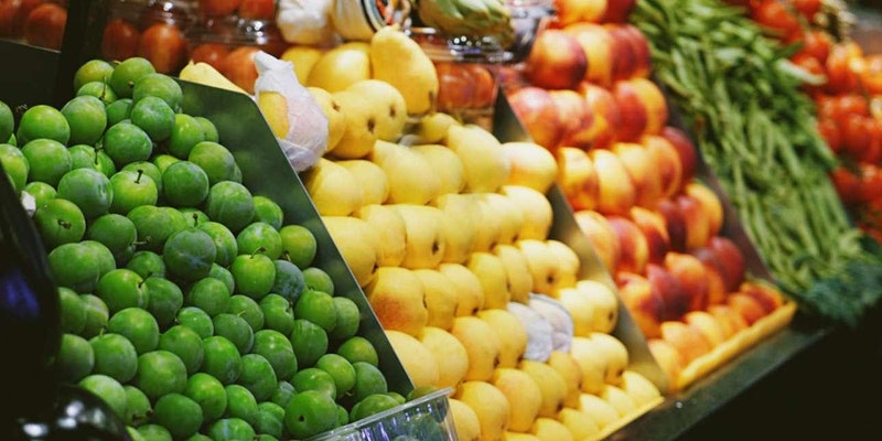 a picture of fruits on a stand.