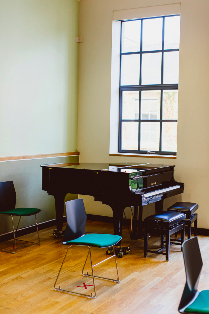 Baby grand piano in Jerome Booth Music Therapy Centre hall