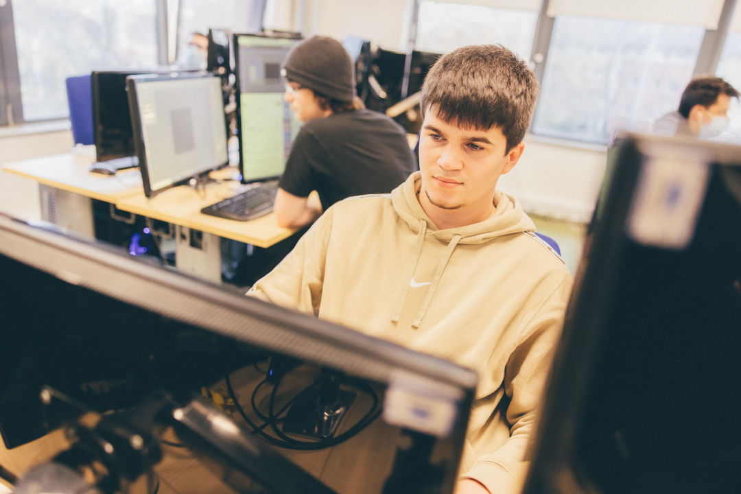 Students using computers in games development studio