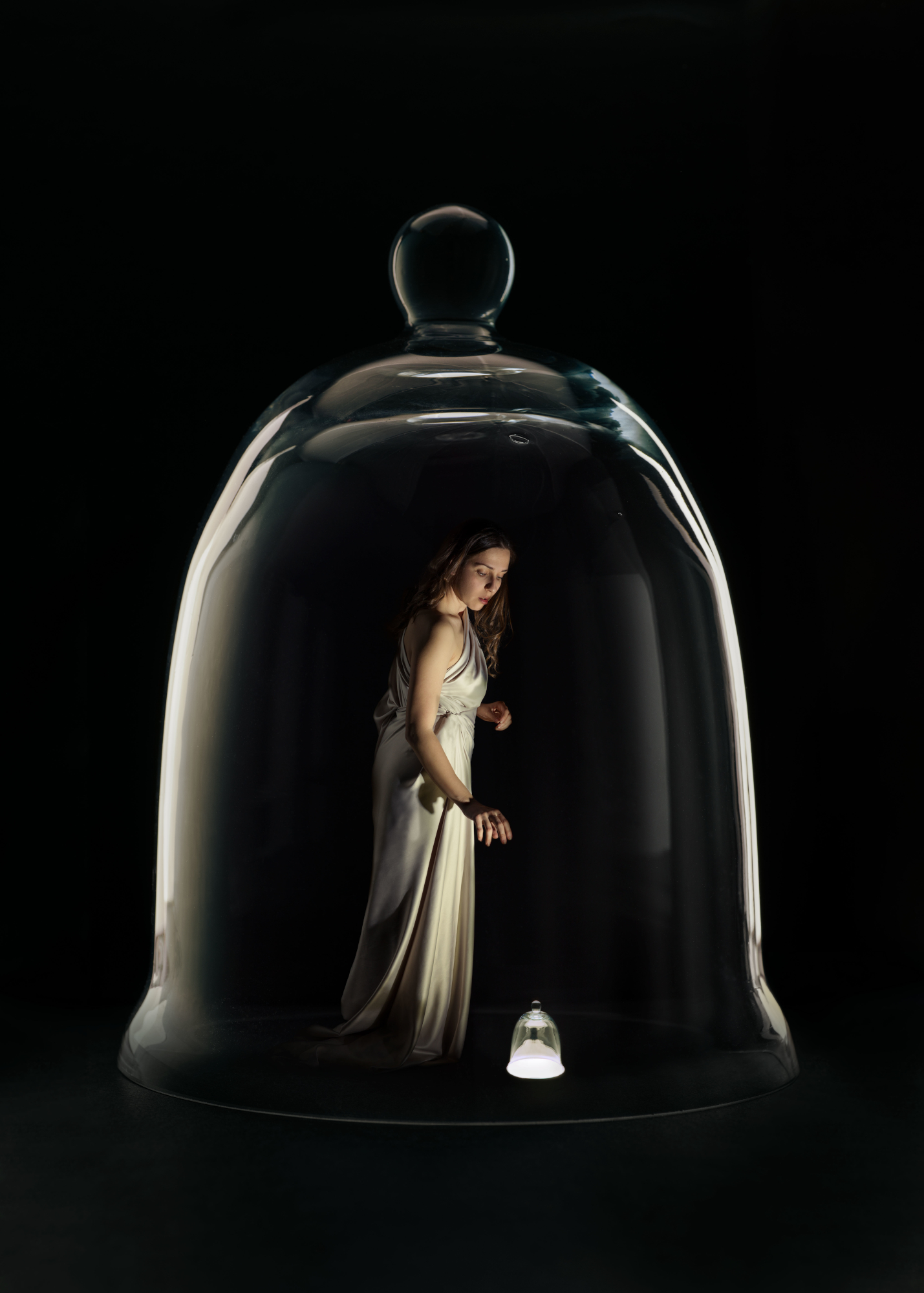Photo of woman inside bell jar