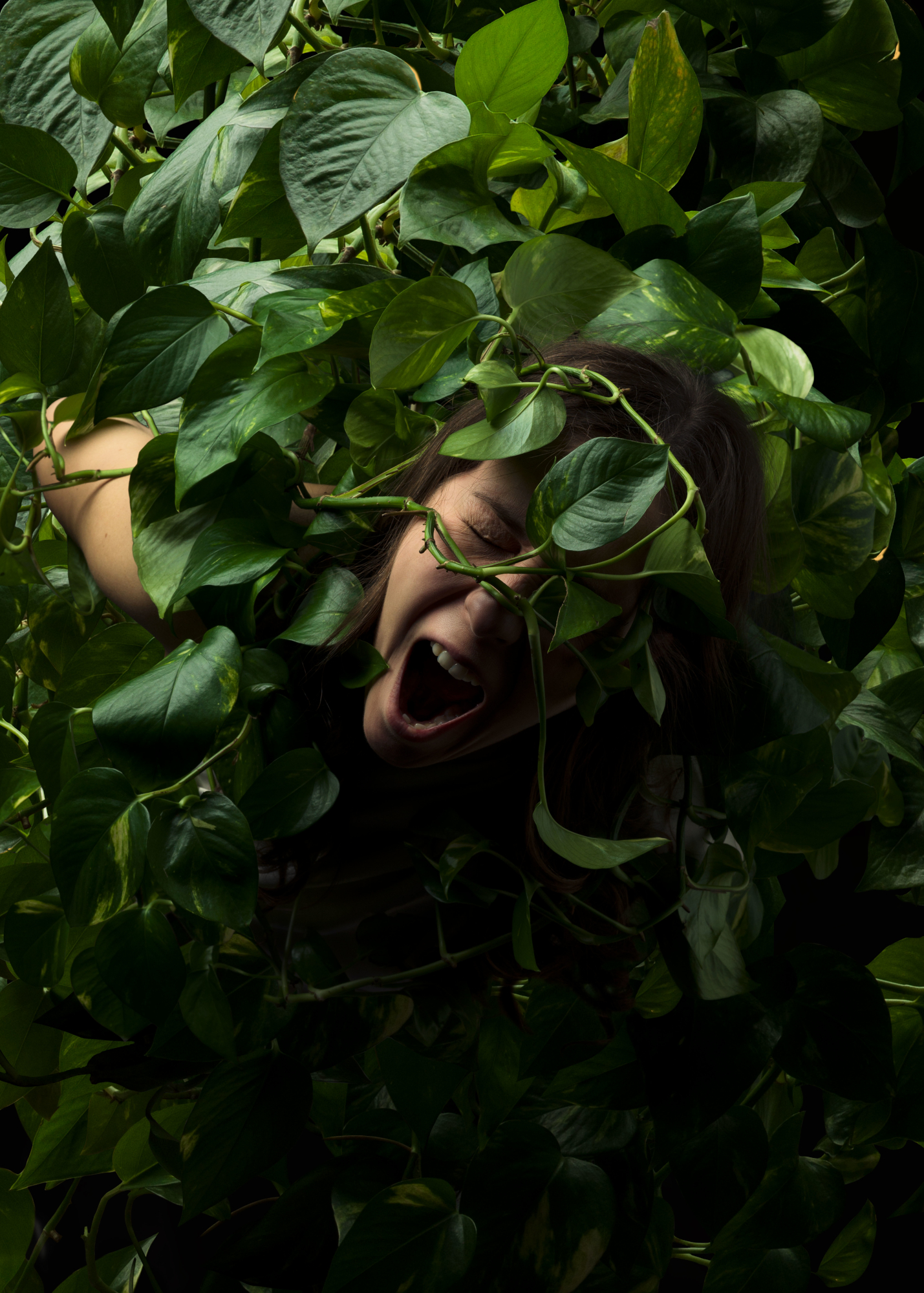 Photo of woman entangled by plant