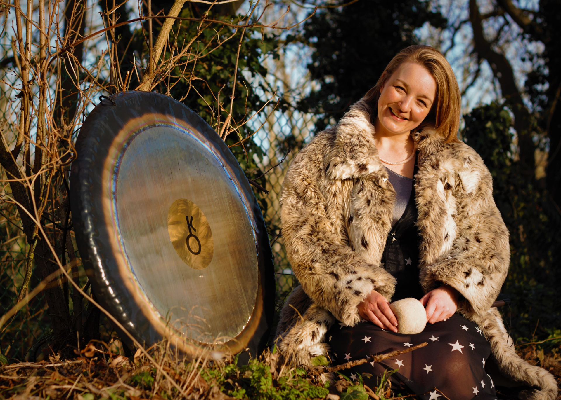 Claire White next to gong outside