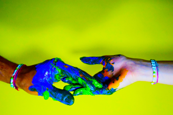 Two painted hands connecting