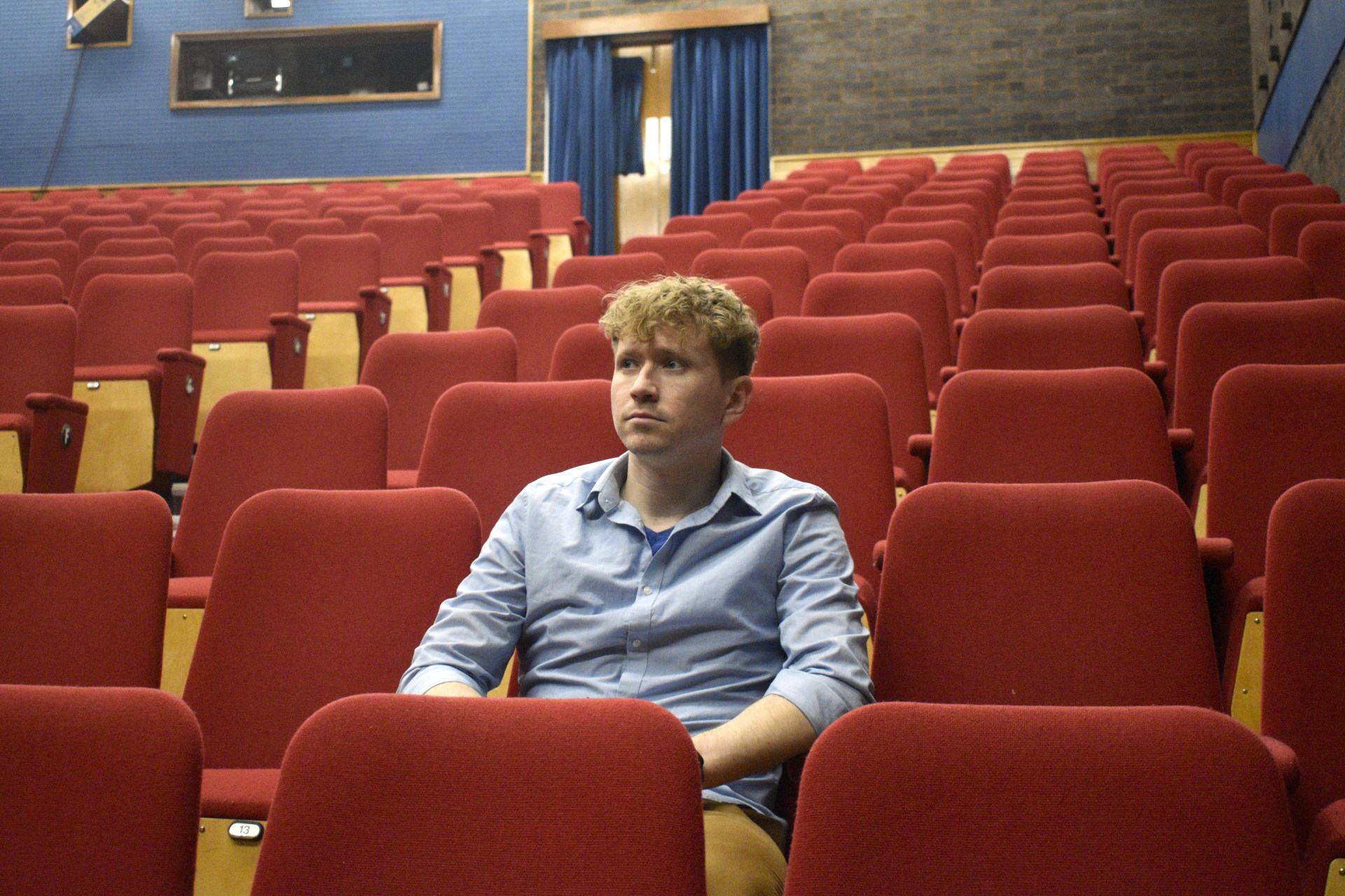Trey Augustus sitting in Mumford Theatre