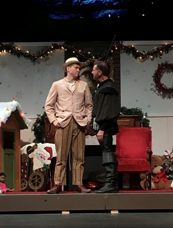 Trey Augustus on stage with another actor in Christmas scene