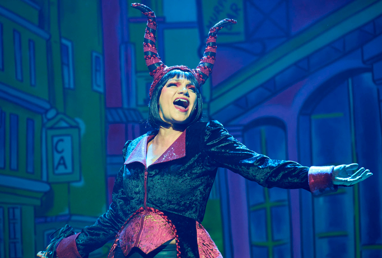 Pippa singing onstage in Maleficent costume