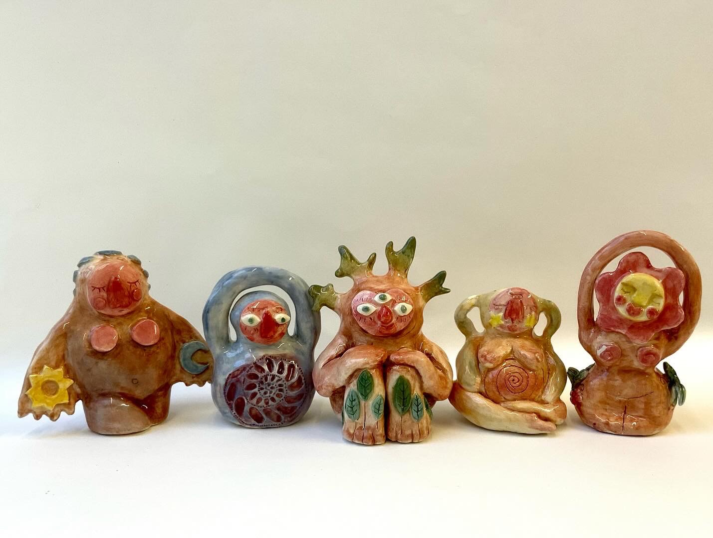 Five ceramic goddess dolls