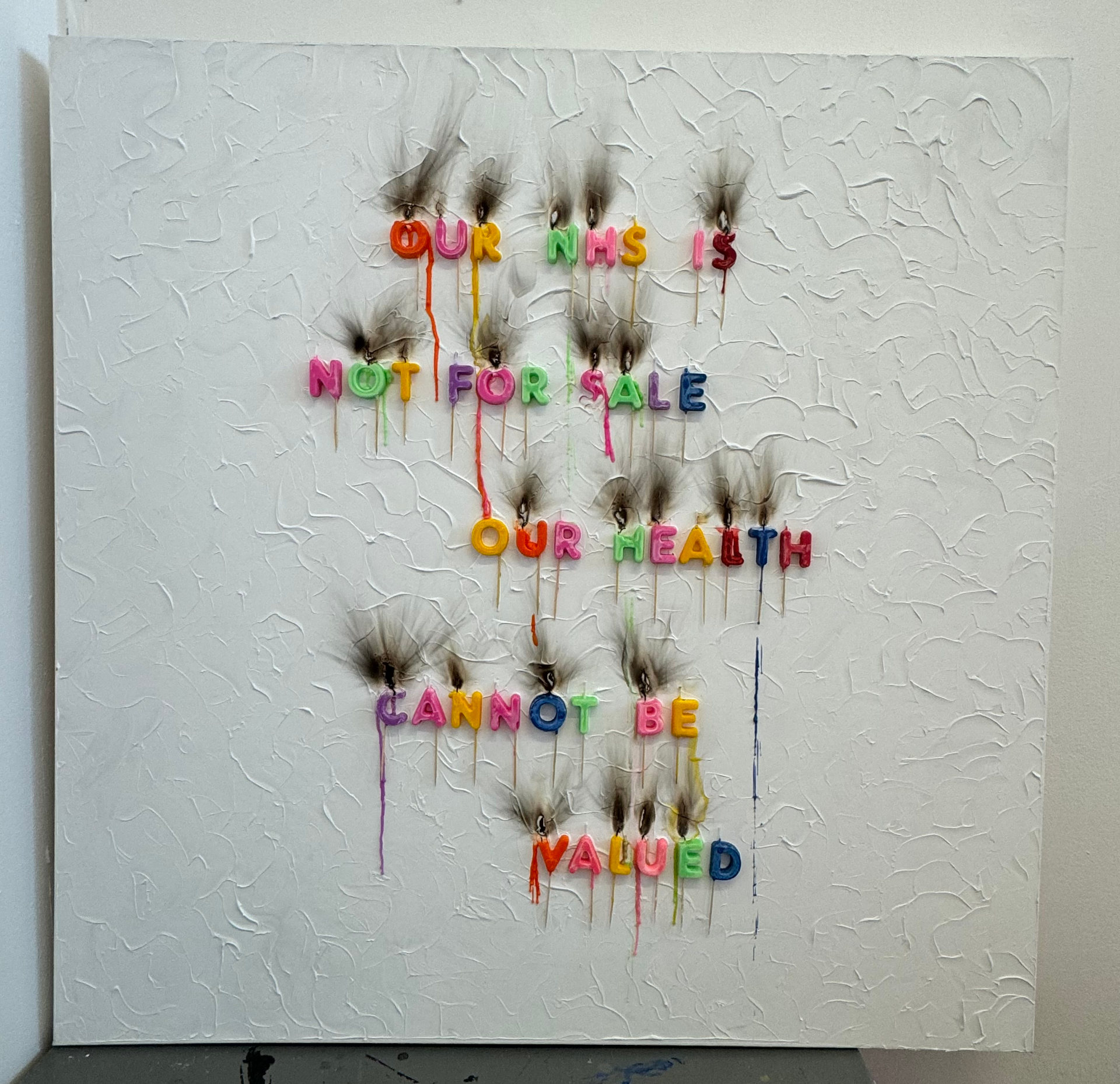 Canvas with fridge magnet letters spelling out 