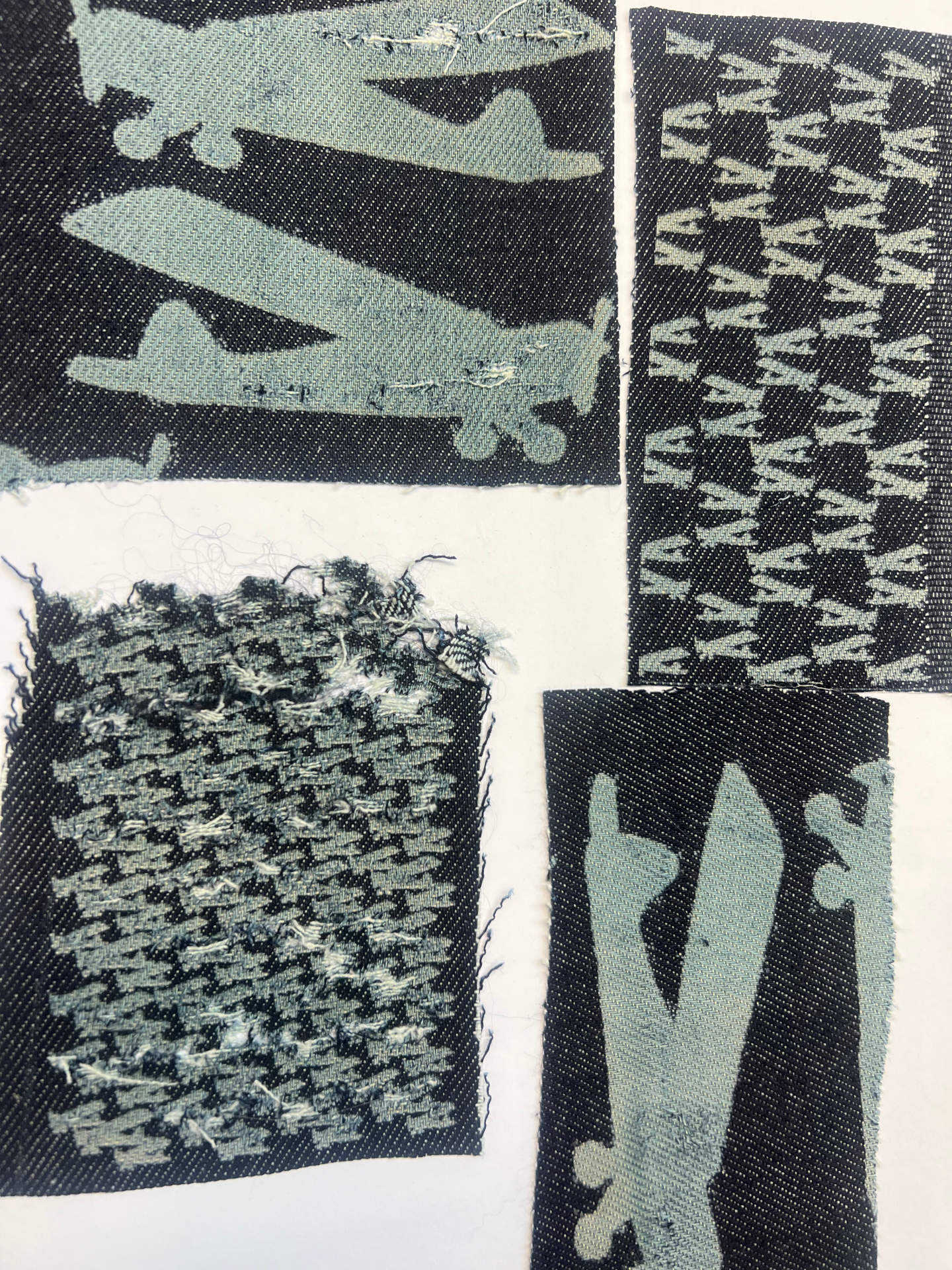 Four pieces of fabric with areoplanes pattern