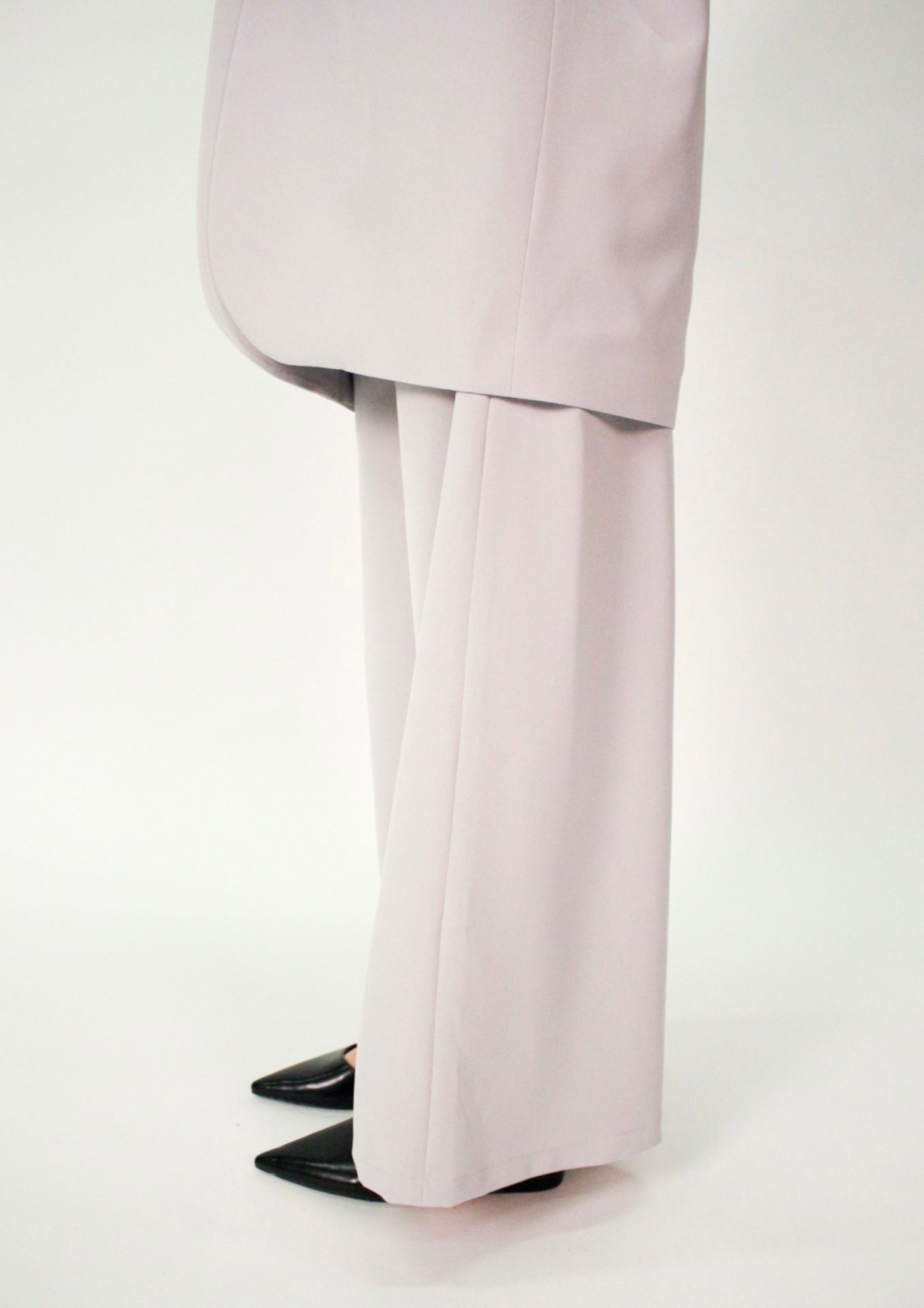 Photo of lilac trousers and bottom of lilac jacket