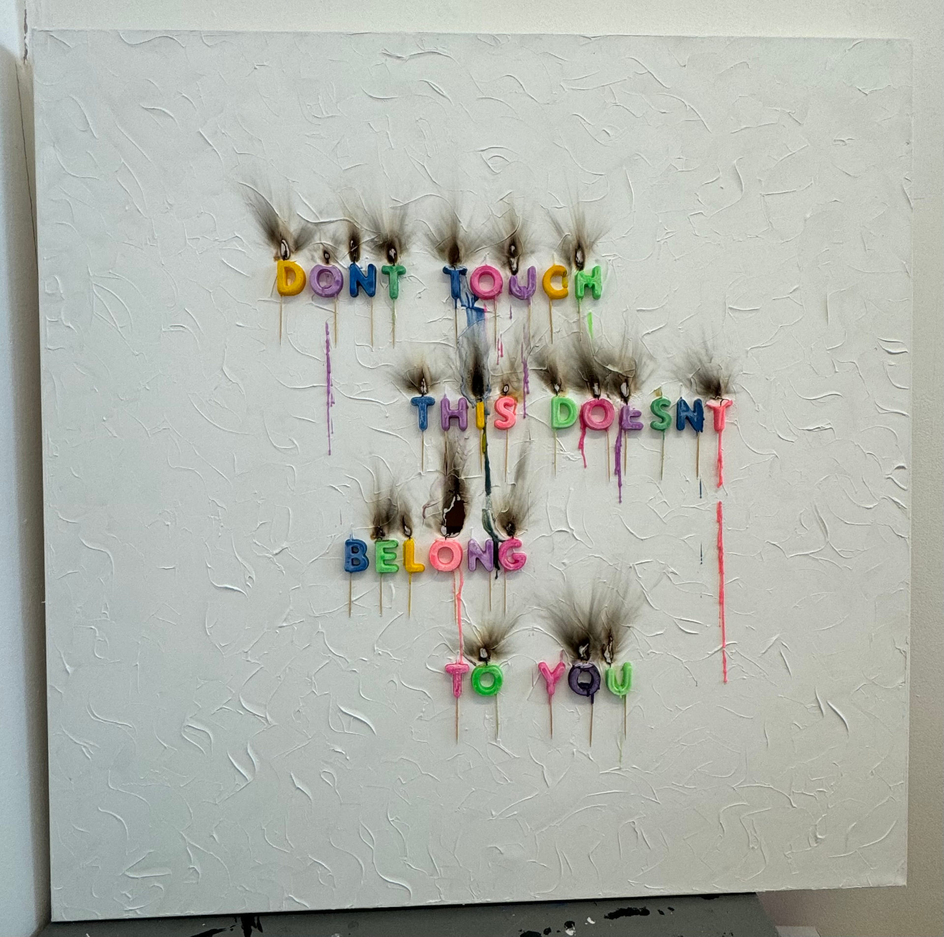 Canvas with fridge magnet letters spelling out 