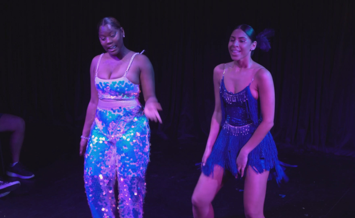 Two female students dancing