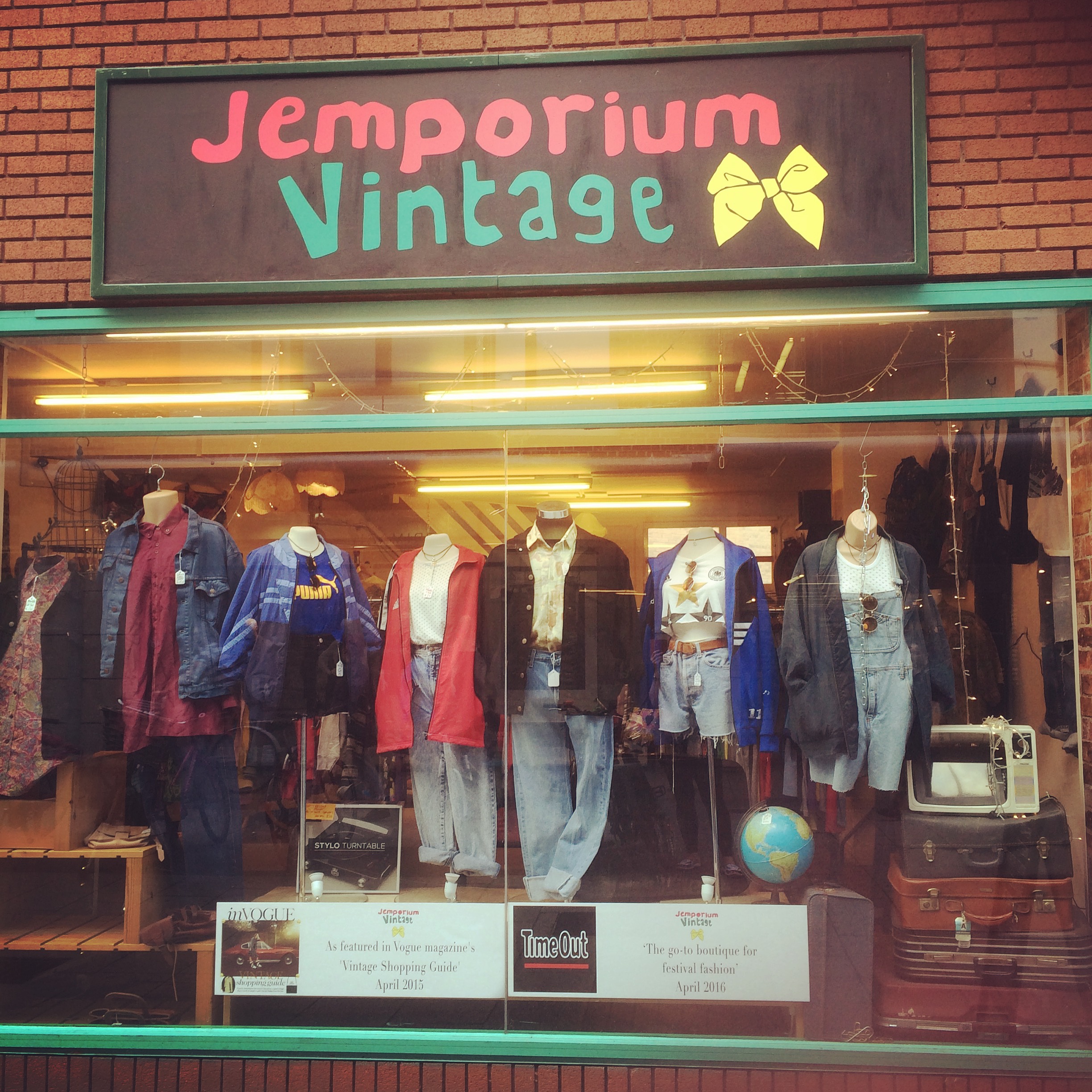 Jemporium Vintage pictured from outside with mannequins in the window.