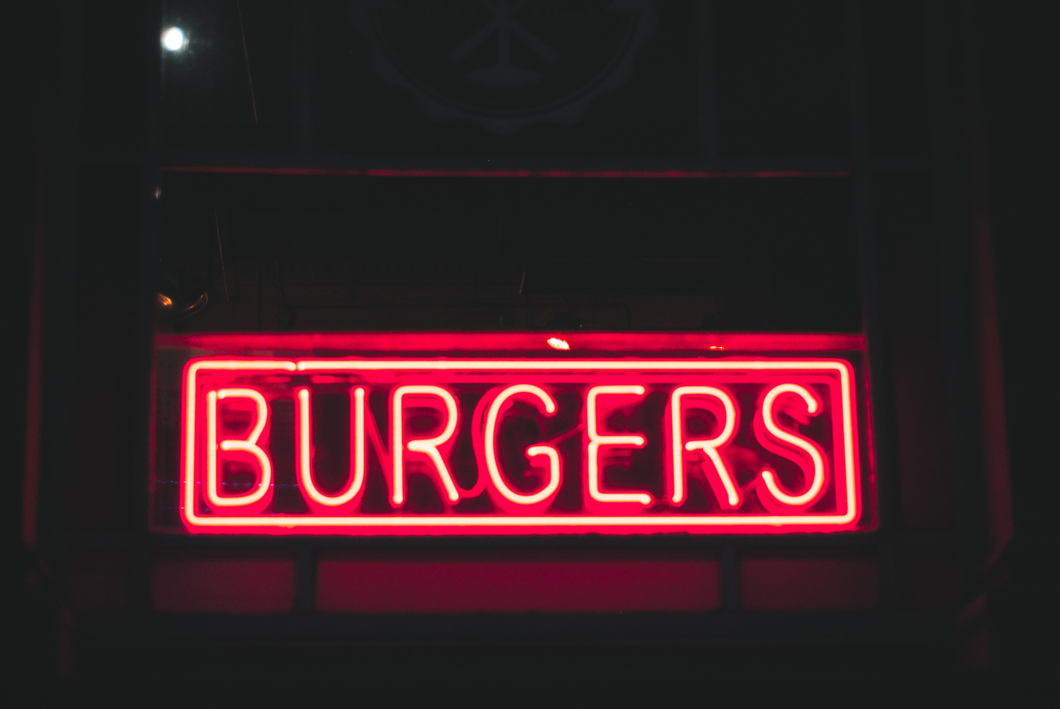 A box light with the word burgers illuminated.