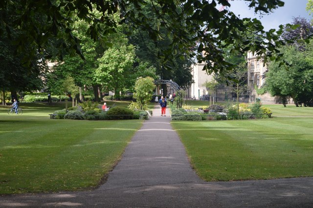 A photograph of people walking through Christ's Pieces, Cambridge.