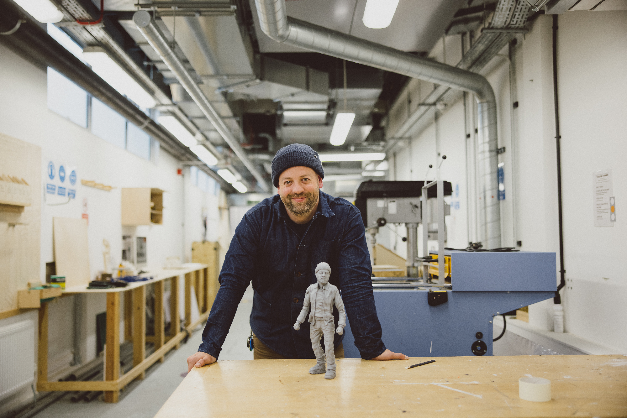 Andy McDowall in 3D workshop with small 3D model of himself
