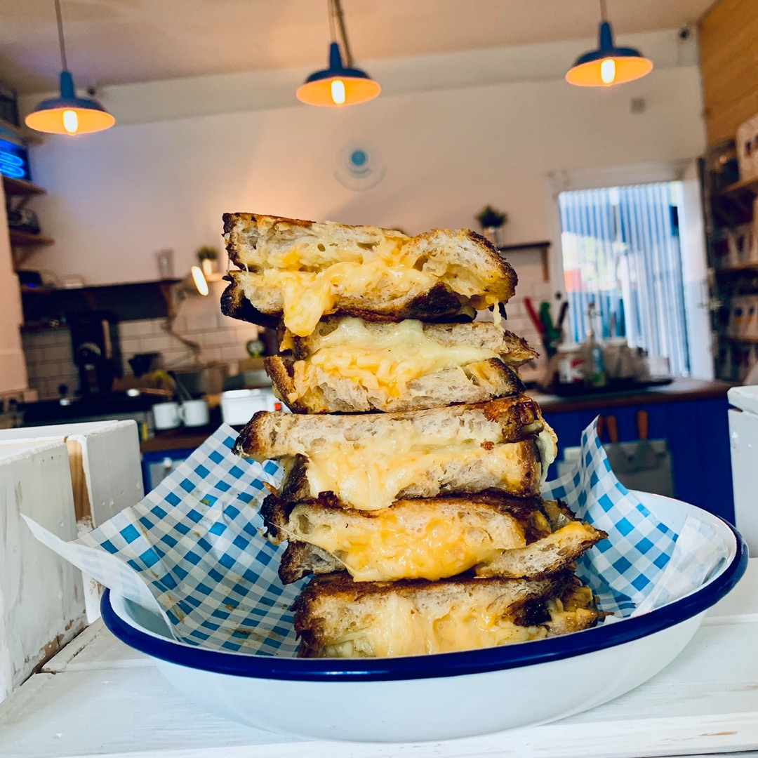 A pile of cheese toasties in a bowl