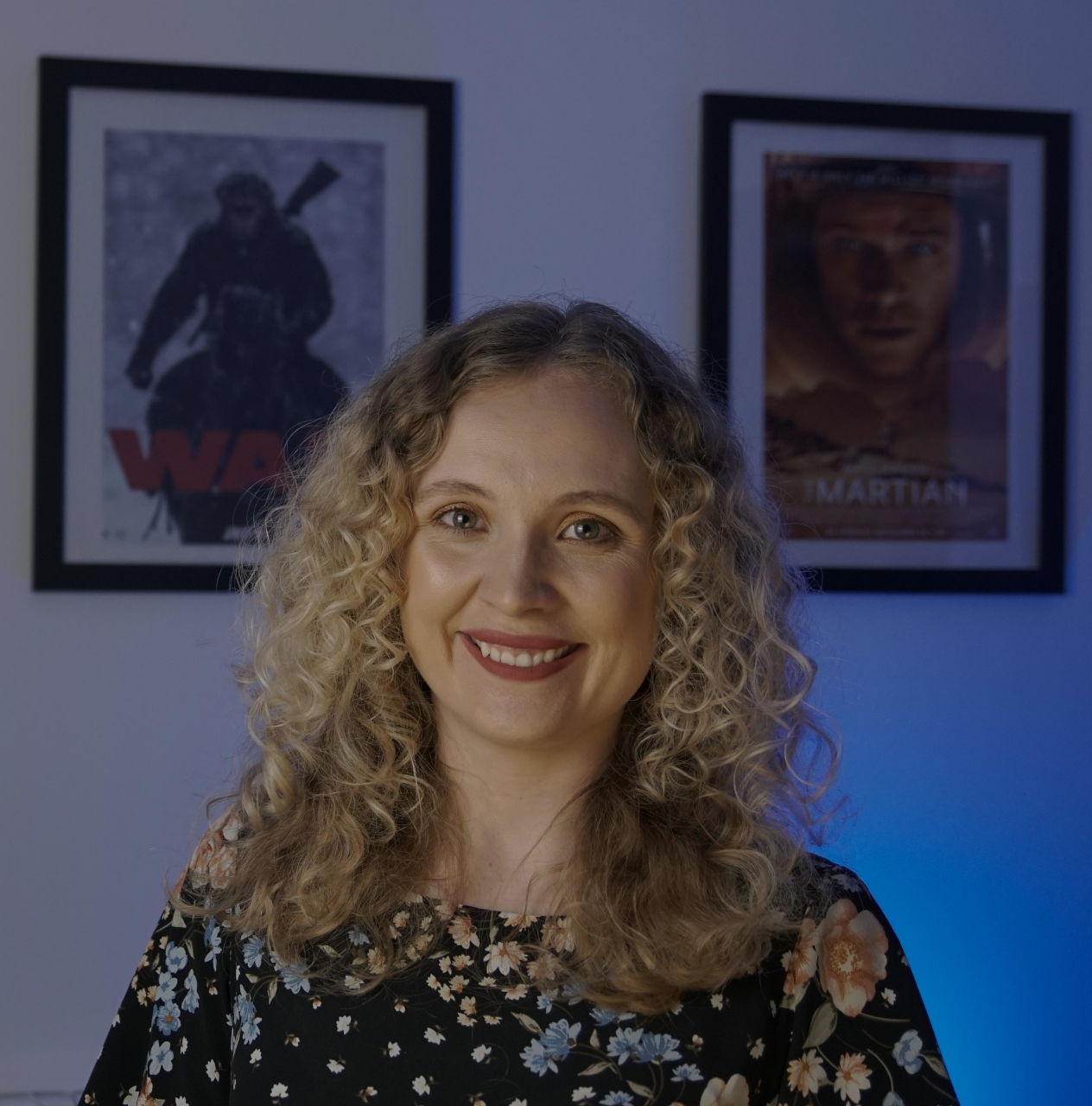 Victoria Burrows in front of TV posters