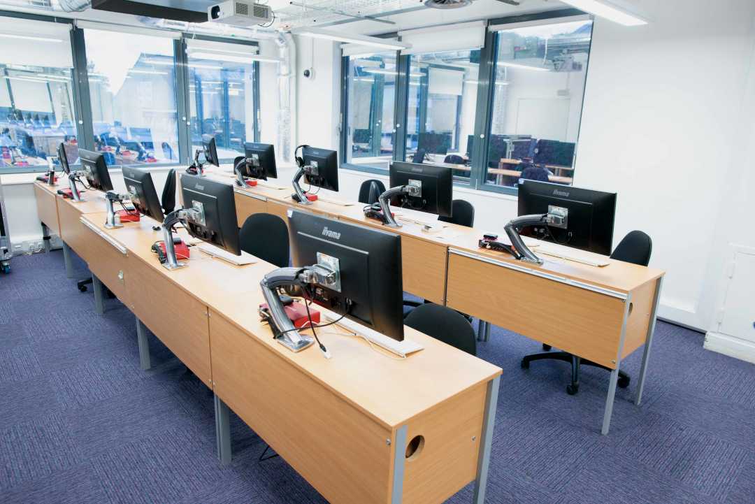 Rows of desks with audio and music technology computers