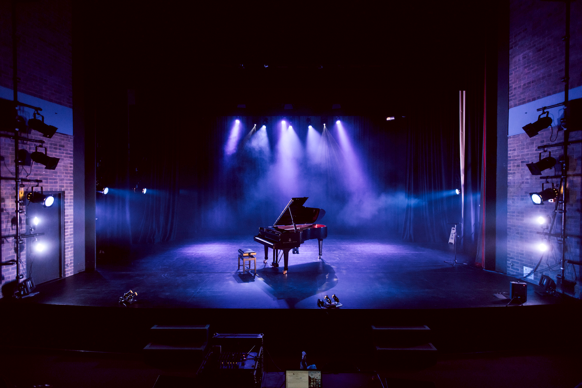 Baby grand piano on stage in Mumford Theatre