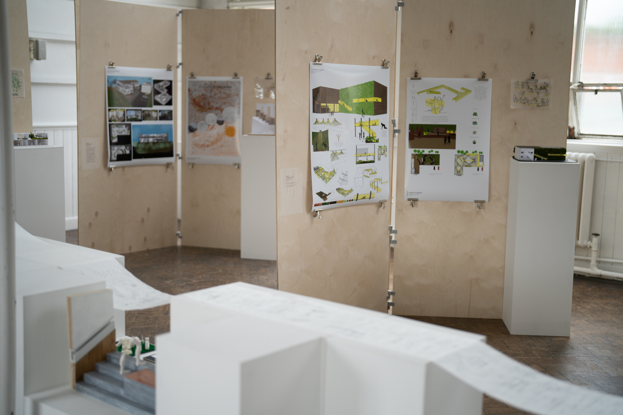 Various interior design plans and models on display