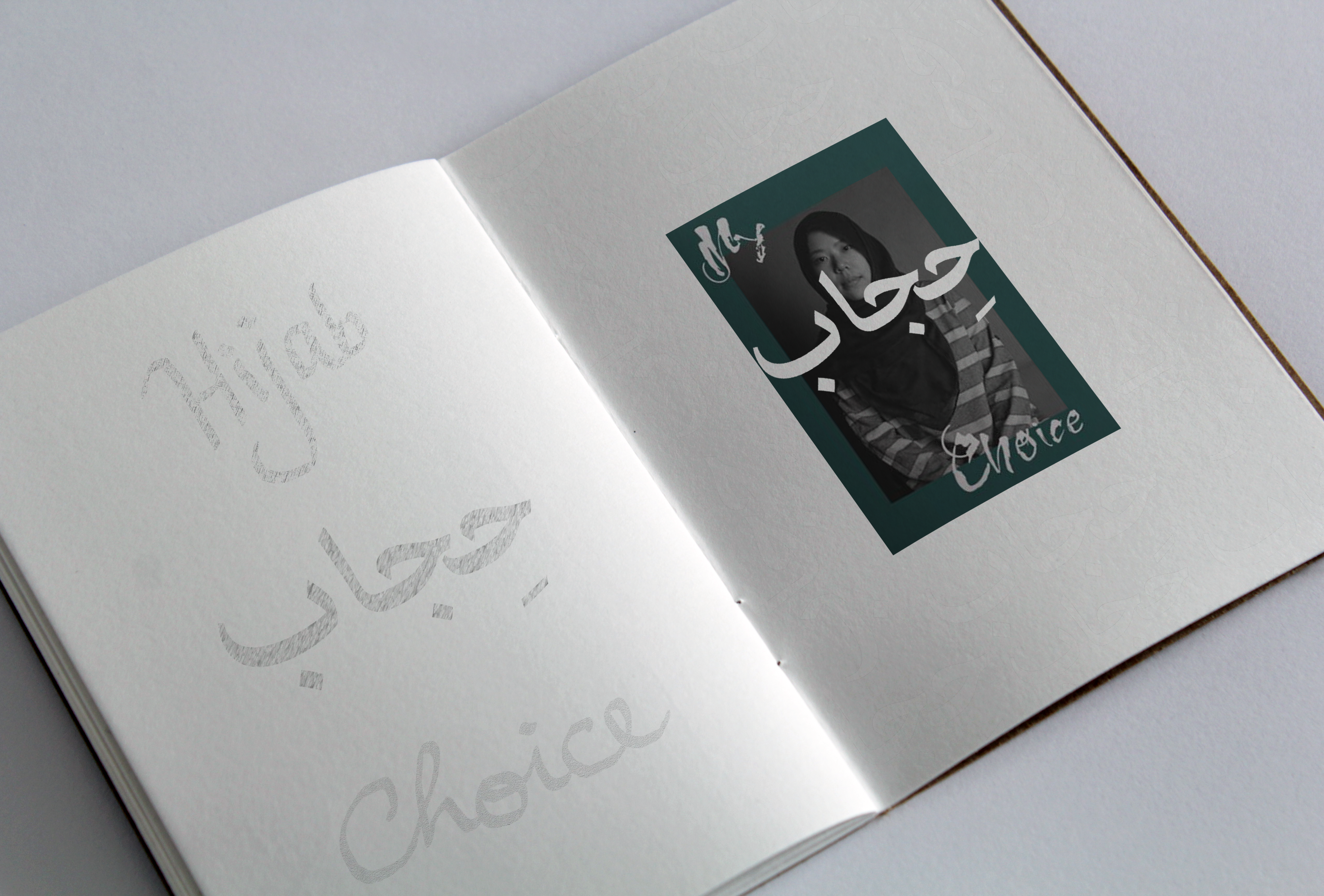 Book open on hijab poster and words 'hijab' and 'choice'
